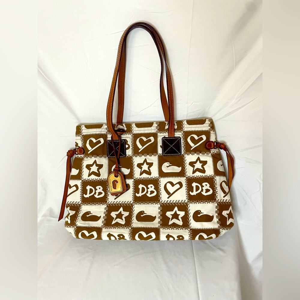 Dooney & Bourke with duck, heart, star, and DB, pink interior